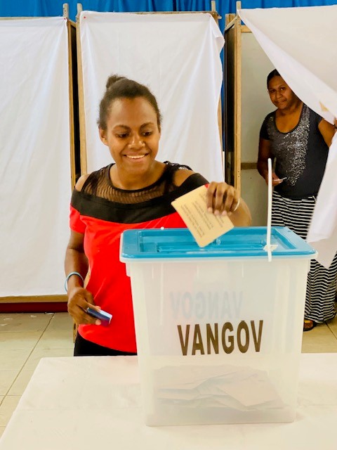 Young woman voting