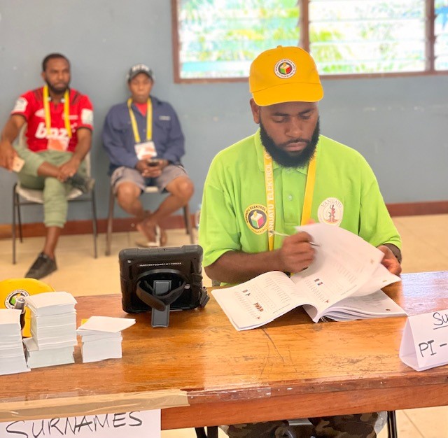 VEO Staff checking the Voter roll